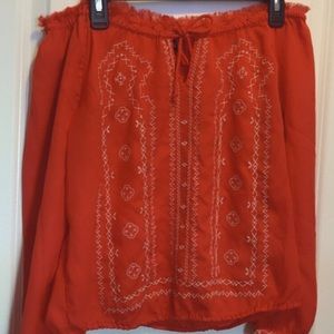 Long sleeved sheer shoulder top